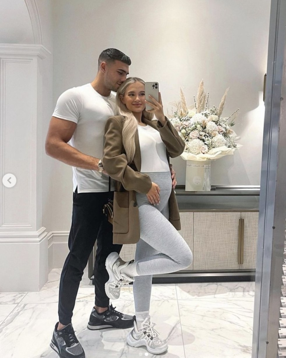 Molly-Mae Hague and Tommy Fury cradling her baby bump 